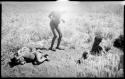 Four unidentified boys, two lying on the ground, and Elizabeth Marshall Thomas