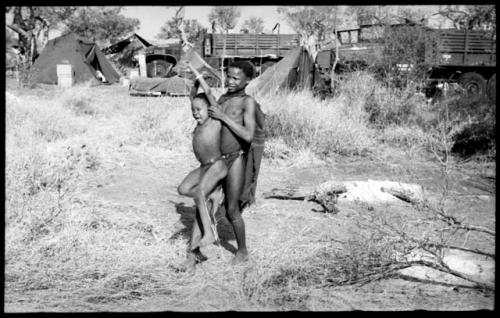 Unidentified boy carrying "Little ≠Gao"