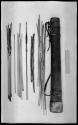 Quiver next to sticks and arrows and a ruler for measurement