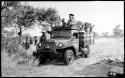 Members of the expedition including Elizabeth Marshall Thomas, Kernel Ledimo, John Marshall, and Robert Story, and Ju/'hoansi on the Dodge power wagon