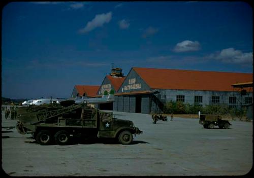 Vehicles and airplane hangars at Camp Matsushima