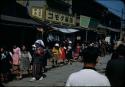 School girls walking along street