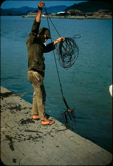 Man fishing from dock