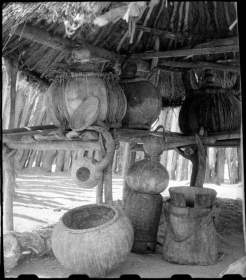 Gourds, pots and baskets inside storage hut