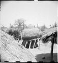 Large storage basket for grain in cradle, with plastered top instead of thatched roof