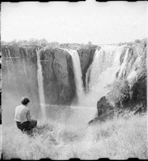 Elizabeth Marshall Thomas sitting and looking at the main jet of Ruacana Falls