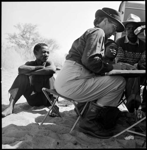 "/Qui Hunter" and /Qui (brother of "Gao Helmet') recording word list with Kernel Ledimo and Lorna Marshall, with Lorna Marshall writing