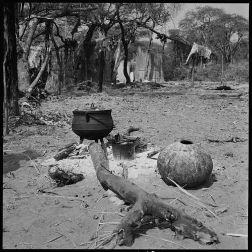 Cooking fire, with huts in background