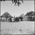 Huts and fence in village