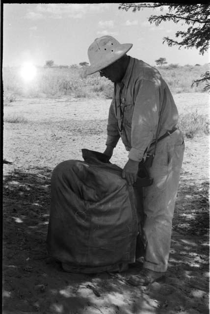 Laurence Marshall with a large bag on the ground