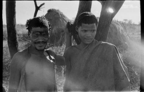 Two men standing, close-up