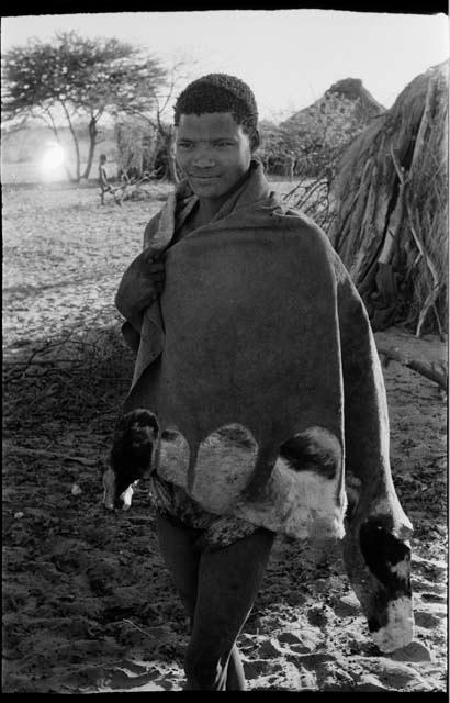 Young man standing wearing a kaross