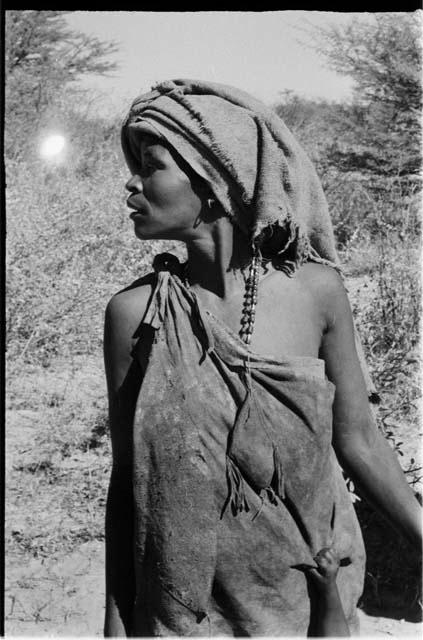 Woman with a piece of blanket on her head, close-up