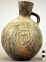 Pottery jar, handle on side, black,  flat sides, stamped ornament