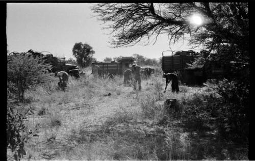 Expedition members clearing camp site