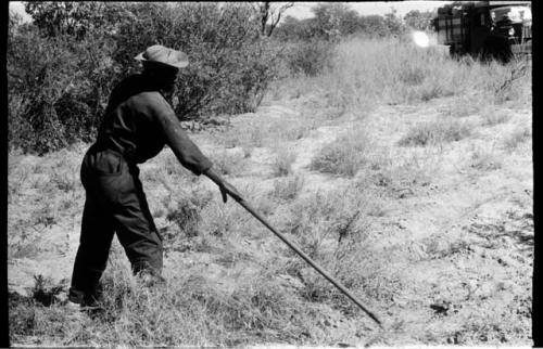 Expedition member raking