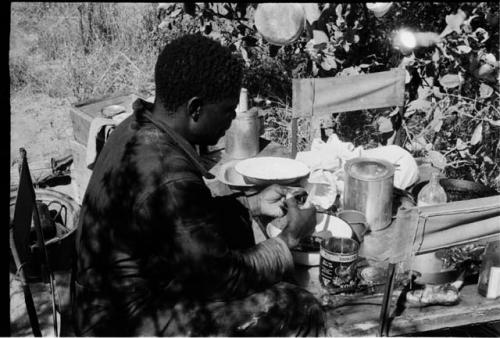 Philip Hameva preparing a meal