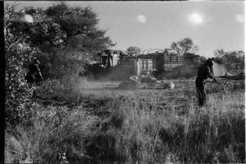 Two expedition members clearing the camp site