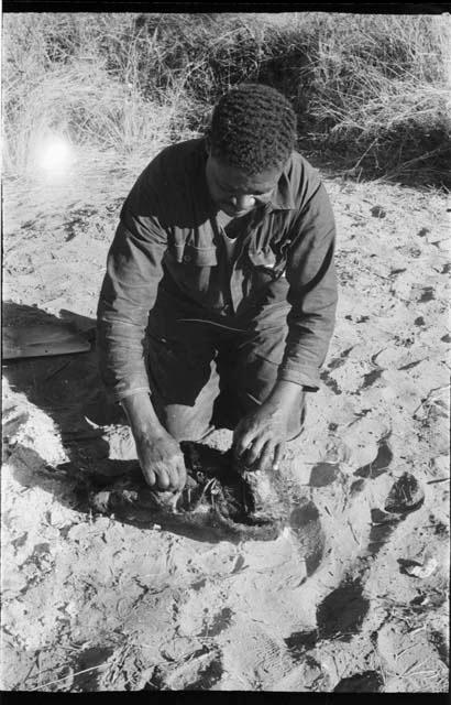 Philip Hameva holding hide with springbok