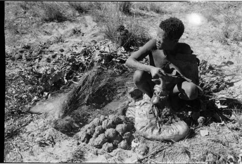 Oukwane sitting with gemsbok stomach bag