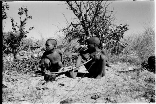 /Gaiamakwe and !Ou/ke playing a musical bow