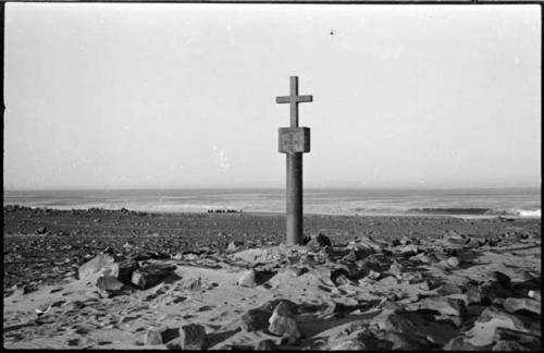 Monument on beach, with seals in background