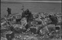 Men breaking up blocks of salt at Bitters Pan