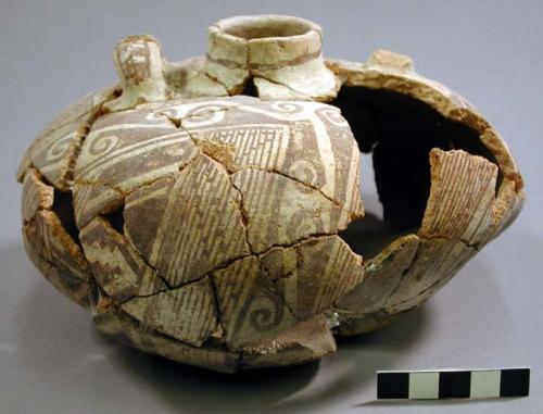 Partially reconstructed vessel and 3 sherds