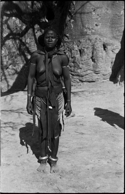 Woman standing in front of baobab tree