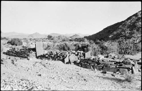 Rock structure, with hill in background