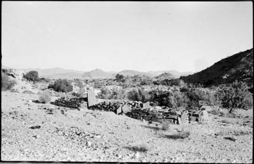 Rock structure, with hill in background