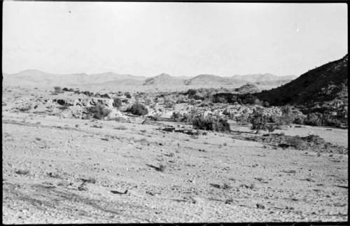 Landscape, with rock structure and hill in distance