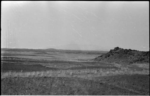 Hill, with hills and mountains in distance