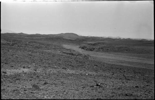 Road, with hills in the distance