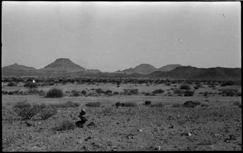 Small pile of rocks, with hills in the distance