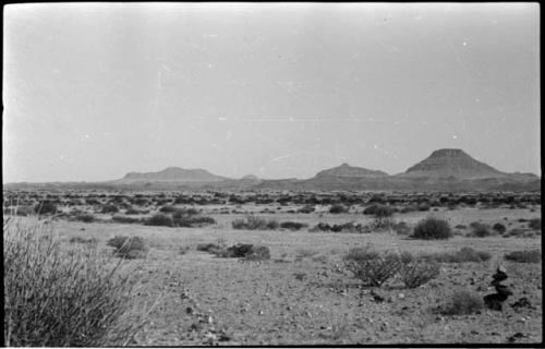 Small pile of rocks, with hills in the distance