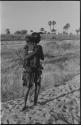 Woman standing and holding a baby