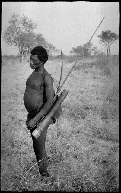 "Old Gau" with a quiver, bow, and spear hanging over his left shoulder