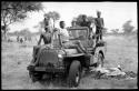 John Marshall and unidentified Ju/'hoansi in a Jeep