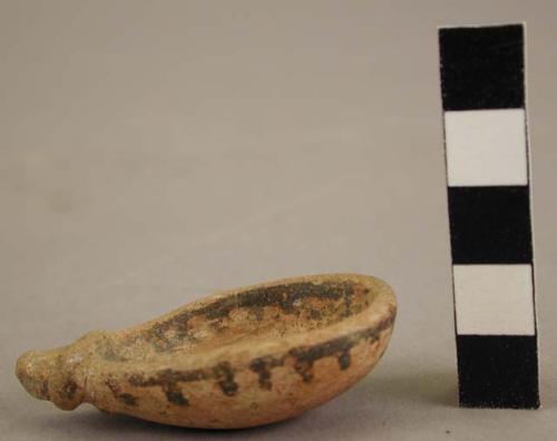 Shell shaped polychrome pottery ladle