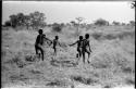 Ju/'hoan boys running, seen from behind