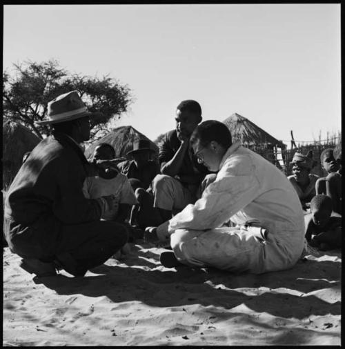 Kebuelemang and other people being interviewed by Kernel Ledimo and Nicholas England