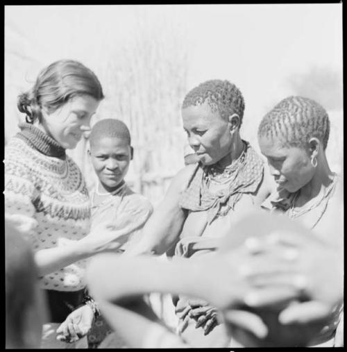 People having their skin color documented by Deborah Marshall