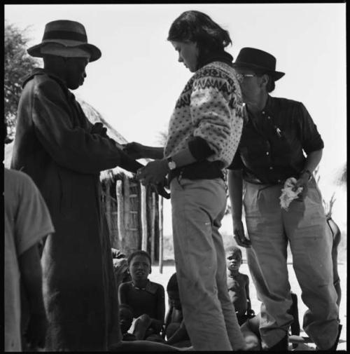 Man having his skin color documented by Lorna Marshall and Deborah Marshall