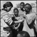 Woman having her skin color documented by Deborah Marshall