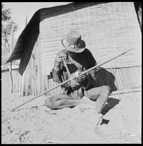 Kafuro playing the hunting bow, braced, with calabash