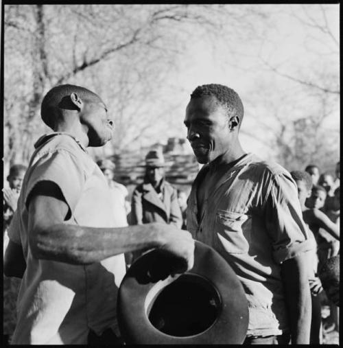 Two men posturing in dance