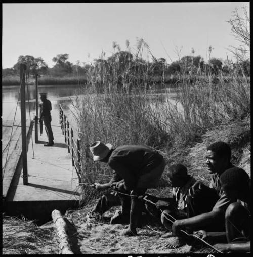 Men pulling a float