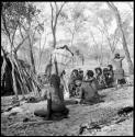 Group of women and children sitting near a skerm