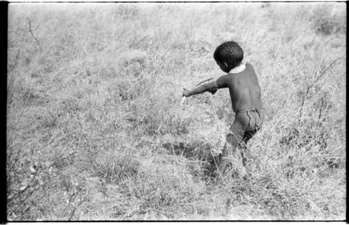 Back view of /Gaishay shooting an arrow